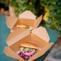freshly prepared burgers in take away boxes on table at restaurant - junk food stock pictures, royalty-free photos & images