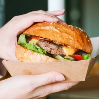 freshly prepared cheeseburger in a paper box - junk food stock pictures, royalty-free photos & images