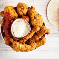 fried chicken strips, fingers and drumstick, crispy fried breaded chicken strips, - junk food stock pictures, royalty-free photos & images