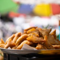 fried samaosas, a fried indian snack, selling at morning market in thailand - junk food stock pictures, royalty-free photos & images