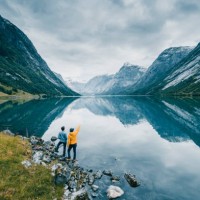 friends admiring the view on the banks of a norwegian fjord, norway - travel stock pictures, royalty-free photos & images