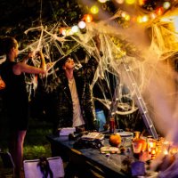 friends arranging halloween party decorations in the backyard - home decoration stock pictures, royalty-free photos & images