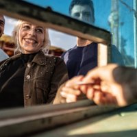 friends buying tickets at a ticket booth in the amusement park - concert stock pictures, royalty-free photos & images