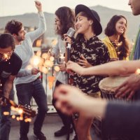 friends celebrating new year on rooftop party - concert stock pictures, royalty-free photos & images