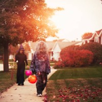 friends dressed as witch and zombie, trick or treating in neighbourhood - garden decoration stock pictures, royalty-free photos & images