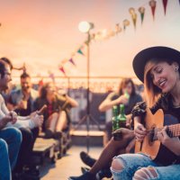friends drinking and partying on the rooftop - concert stock pictures, royalty-free photos & images