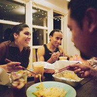 friends eating asian takeout - junk food stock pictures, royalty-free photos & images
