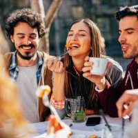 friends eating at a restaurant - food stock pictures, royalty-free photos & images