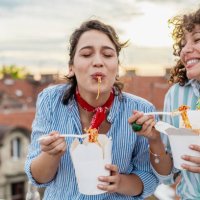 friends eating fast food meal and hanging out - junk food stock pictures, royalty-free photos & images