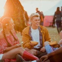 friends eating food at a festival - concert stock pictures, royalty-free photos & images
