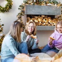 friends eating pizza for christmas - junk food stock pictures, royalty-free photos & images