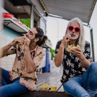 friends eating street food together - junk food stock pictures, royalty-free photos & images