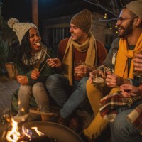 friends enjoy in winter night at porch - garden decoration stock pictures, royalty-free photos & images