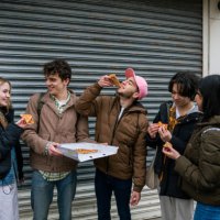 friends enjoying a pizza together - junk food stock pictures, royalty-free photos & images