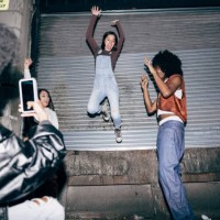 friends filming to share on social media at a party - fashion stock pictures, royalty-free photos & images