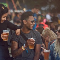friends hanging out with beers at festival - concert stock pictures, royalty-free photos & images