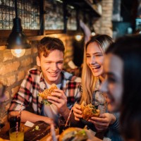 friends having a meal together - food stock pictures, royalty-free photos & images