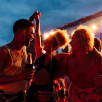 friends having fun drinking beer and dancing at concert - concert stock pictures, royalty-free photos & images