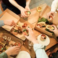 friends having home party with vegan food - junk food stock pictures, royalty-free photos & images
