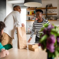 friends having lunch at home - junk food stock pictures, royalty-free photos & images