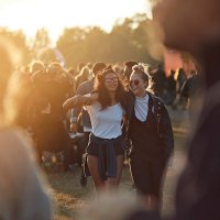 friends laughing together at big festival - concert stock pictures, royalty-free photos & images