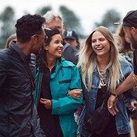friends laughing together at outside festival - concert stock pictures, royalty-free photos & images