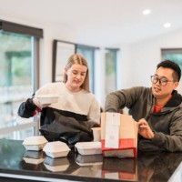 friends opening delivery box. - junk food stock pictures, royalty-free photos & images