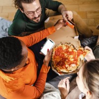 friends ordering food online - junk food stock pictures, royalty-free photos & images