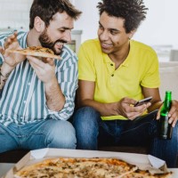 friends playing video games - junk food stock pictures, royalty-free photos & images