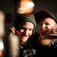 friends playing with chili peppers making moustaches - food stock pictures, royalty-free photos & images