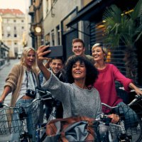 friends riding bicycles in a city - travel stock pictures, royalty-free photos & images