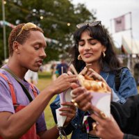 friends sharing dessert at music festival - concert stock pictures, royalty-free photos & images
