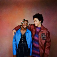 friends standing against brown background - fashion stock pictures, royalty-free photos & images