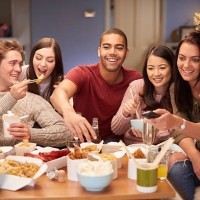 friends watching tv with take away - junk food stock pictures, royalty-free photos & images