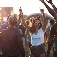friends with arms in the air at festival concert - concert stock pictures, royalty-free photos & images