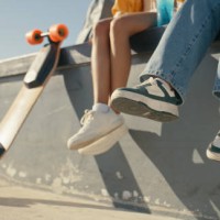 friends, women and shoes at a skate park outdoor in summer for fun, sports and skating. closeup of female people together with casual clothes and a skateboard for freedom, travel adventure and break - fashion stock pictures, 