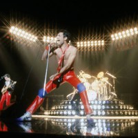 From left to right, musicians John Deacon and Freddie Mercury of the British rock band Queen perform in concert at the Forum on July 9, 1980 in...