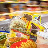 frozen food in shopping cart - junk food stock pictures, royalty-free photos & images