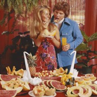 fruit served on table with woman feeding man, smiling - food stock pictures, royalty-free photos & images