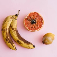 fruit with mold on a pink background - food stock pictures, royalty-free photos & images