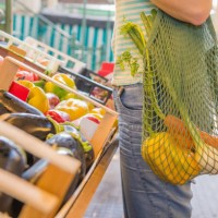 fruits and vegetables in a cotton mesh reusable bag, zero waste shopping concept - food stock pictures, royalty-free photos & images