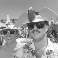 Fujicolor 100 @ 100 ASA Bright sun, flash fill Lesley and Mark Carter of Austin, Texas, wait for the start of their third Denver Jimmy Buffett...