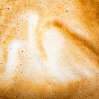 full frame of a cup of freshly made coffee with milk, backgrounds. - coffee stockfoto's en -beelden