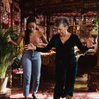 full length of grandmother and granddaughter dancing at home - fashion stock pictures, royalty-free photos & images