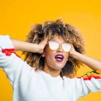 funky afro girl against yellow background - fashion stock pictures, royalty-free photos & images