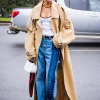 Gala Gonzalez is seen wearing beige long trench coat, white shirt, two tone denim jeans a white bag outside Gucci during the Milan Fashion Week...