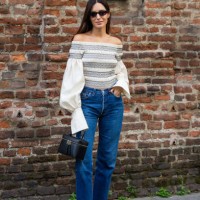 Gala Gonzalez wears off shoulder top with wide sleeves, denim jeans, black bag outside Max Mara during the Milan Fashion Week - Womenswear...