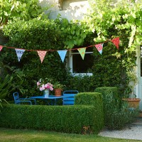 garden and bunting in summer - garden decoration stock pictures, royalty-free photos & images