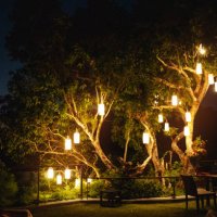 garden bar decorated with illuminated lantern at night - garden decoration stock pictures, royalty-free photos & images