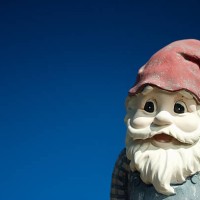 garden gnome with red hat on a blue background - garden decoration stock pictures, royalty-free photos & images